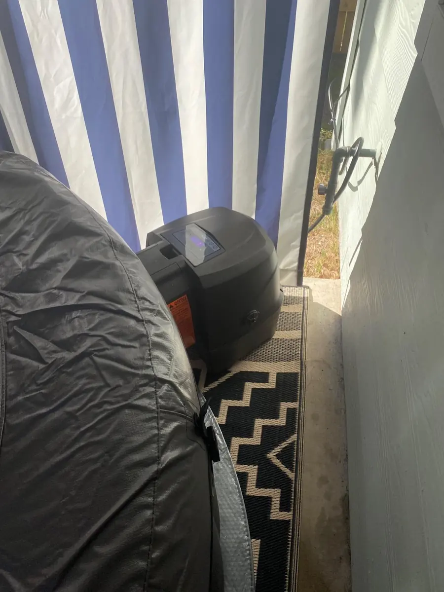 PureSpa with the insulated cover strapped on and the pump unit beside it