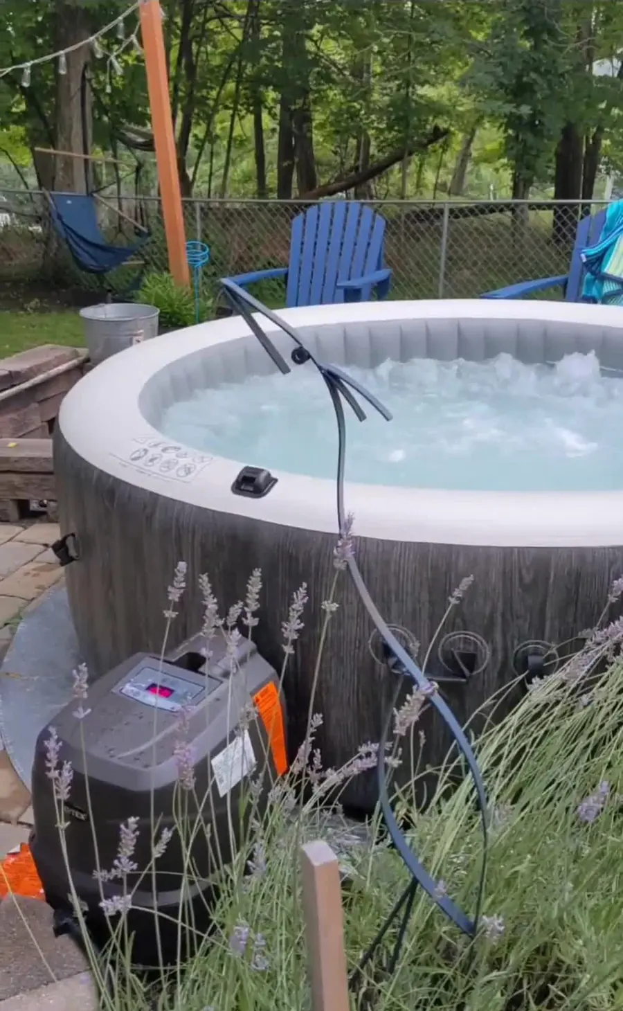 PureSpa on a concrete slab beside a house